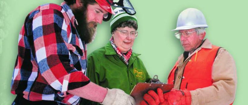Forest owners talking to a logger