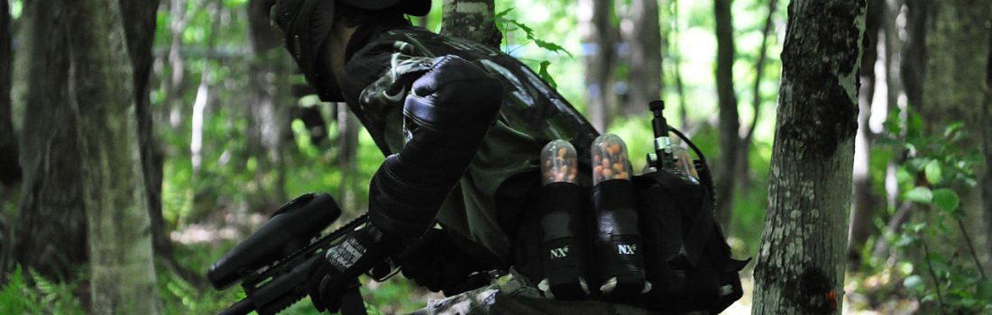 Playing paintball in the woods