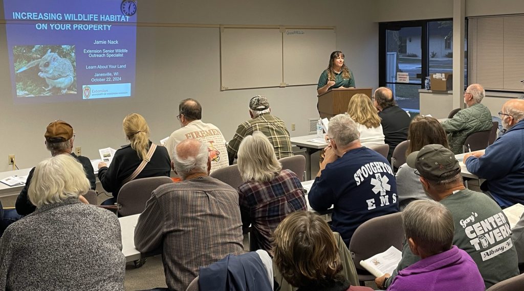 Jamie Nack presents about wildlife to a classroom of landowners