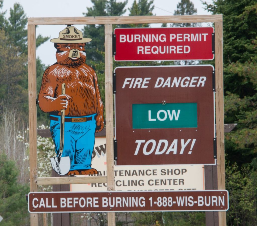 Smokey Bear sign. Burning Permit Required. Fire Danger Low Today.
