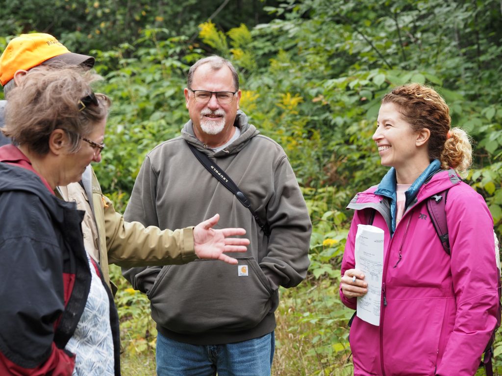 A group of smiling landowners talking
